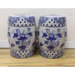 A pair of Chinese blue and white garden seats, 44 cms high.