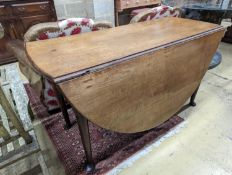 A mid 18th century oak gateleg table. W-132cm, D-156cm, H-71cm.