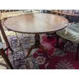 A George III circular oak tilt top tea table, diameter 86cm, height 71cm