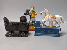 Two painted cast iron money banks ‘Trick Dog’ and ‘Trick Pony’, and a serpentine bathtub