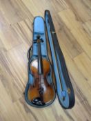 A late 19th century German violin, case, 60 cms long.