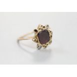 A 19th century yellow metal, garnet and four stone rose cut diamond set dress ring, size P/Q,