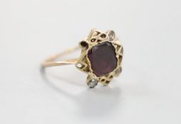 A 19th century yellow metal, garnet and four stone rose cut diamond set dress ring, size P/Q,