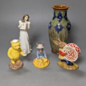 A collection of Royal Doulton figures including Bunnykins, a Doulton vase and other items