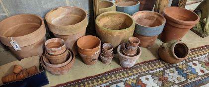 A collection of approximately 40 assorted terracotta planters, largest diameter 32cm