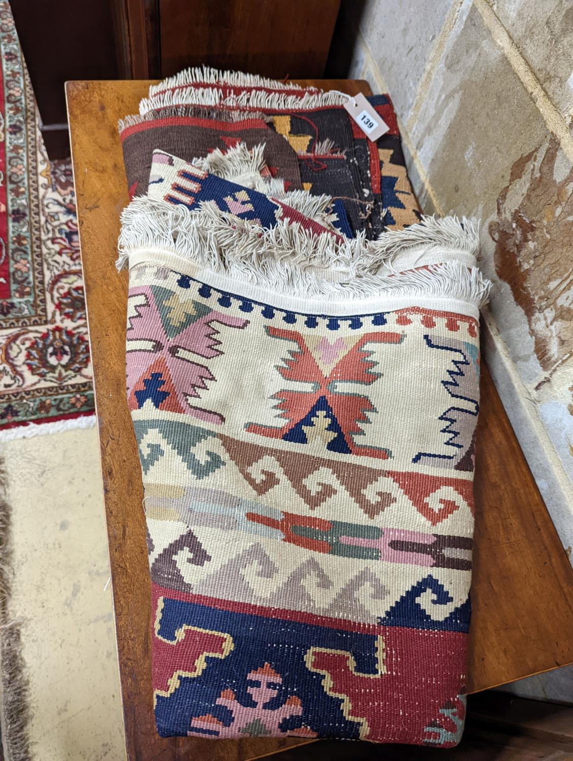 Two Kilim polychrome flatweave rugs, larger 200 x 130cm