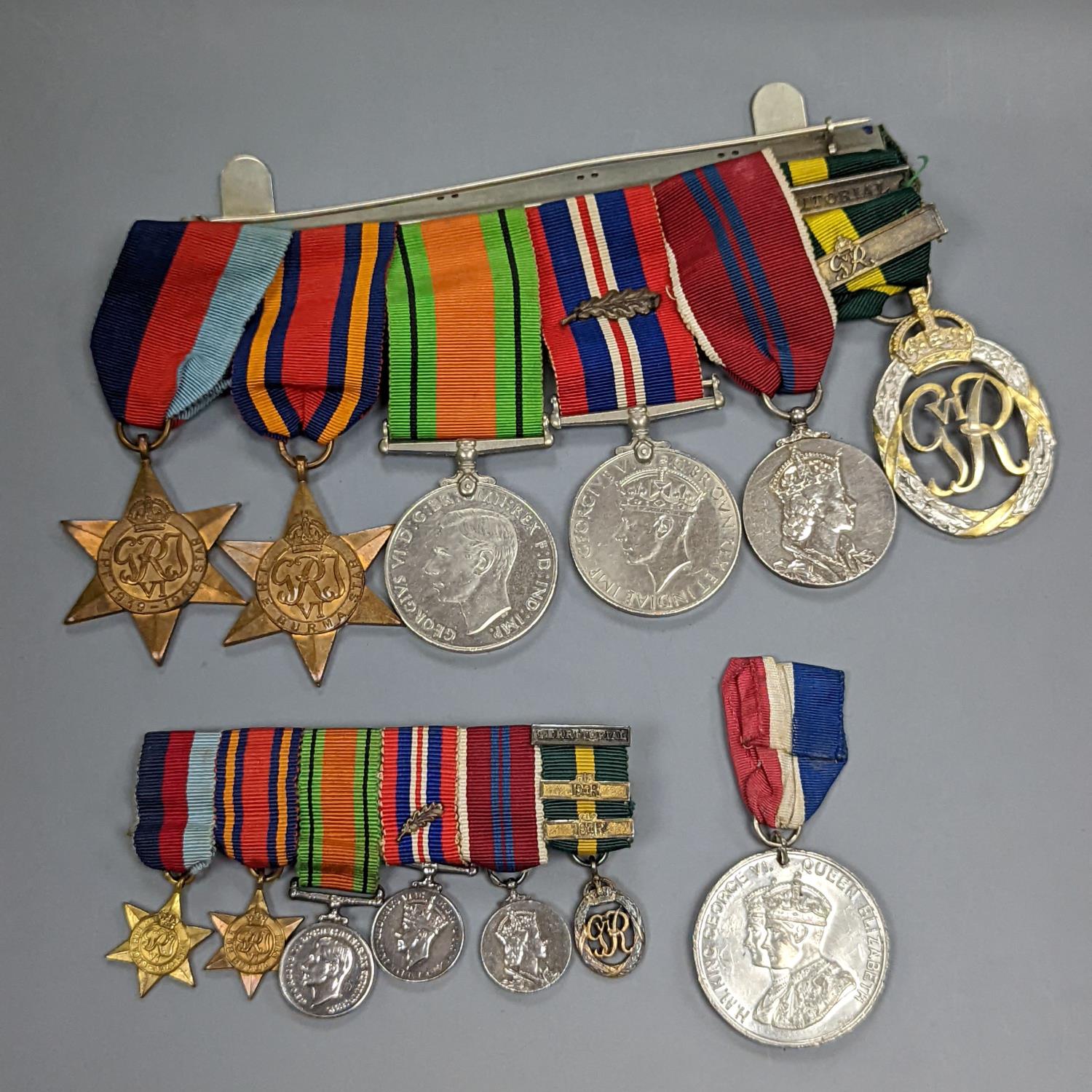 A WWII medal group of six, with miniatures, and a royal commemorative medal, 1937