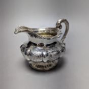A Victorian embossed silver cream jug, J.E. Terry & Co, London, 1838, height 10.9cm,9.5oz.