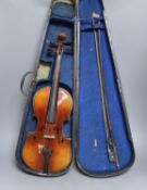 A cased 3/4 size violin, 55cms long.