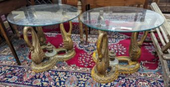 A pair of Empire style circular glass top gilt composition ‘swan’ occasional tables. D-69cm, H-