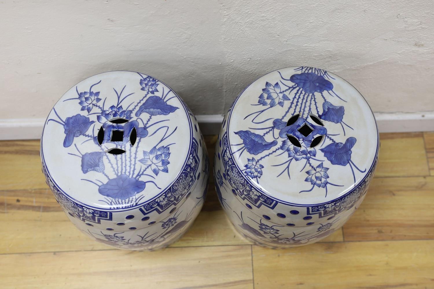 A pair of Chinese blue and white garden seats, 44 cms high. - Image 2 of 3