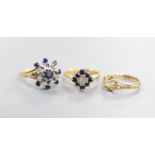 A George V 18ct gold and claw set solitaire diamond ring, size G/H and two later 18ct gold and gem