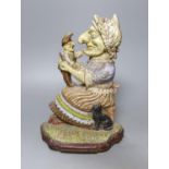 A Victorian painted cast iron Punch and Judy doorstop, 31 cms high.