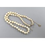 A single strand graduated cultured pearl necklace, with diamond set yellow metal clasp, 38cm.