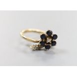 A 585 yellow metal, sapphire and diamond set dress ring, size G, gross weight 2.9 grams.
