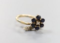A 585 yellow metal, sapphire and diamond set dress ring, size G, gross weight 2.9 grams.