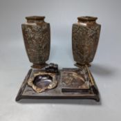 A Japanese bronzed antimony smoker's stand and a pair of vases, stand 19 cms wide.