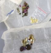 A quantity of assorted loose cut gemstones including sapphires, aquamarine, citrine and