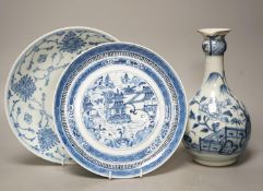 An 18th century Chinese blue and white bottle vase and two 19th century blue and white plates,