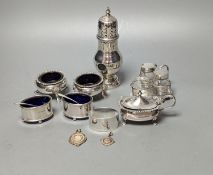 A late Victorian small silver condiment stand with three glass condiments, London, 1883, 49mm, other