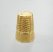 A 750 yellow metal thimble, 23mm,6 grams.