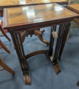 A nest of three Amboyna banded rectangular mahogany tea tables, width 48cm, depth 34cm, height 74cm