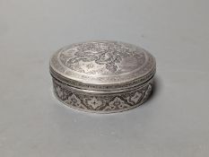 A Persian engraved white metal circular box and cover, 86mm,147 grams.