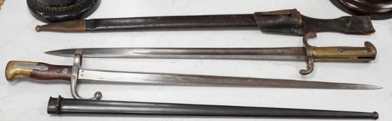 A French bayonet and scabbard with matching serial number (38804) and inscription and date to back