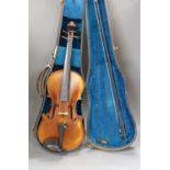 A cased violin, back 36cm, with bow