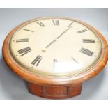 A large Victorian oak-cased dial clock,56 cms diameter.