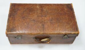 A leather suitcase.77cms wide x 27 cms high.