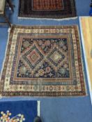 An antique Shirvan rug, signed and dated 1895, 124 x 121cm