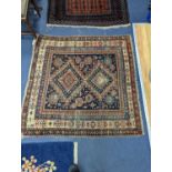 An antique Shirvan rug, signed and dated 1895, 124 x 121cm