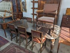 A 1920's oak extending dining table, 238cm extended (two spare leaves), width 120cm, height 74cm