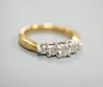 A modern 18k yellow metal and graduated five stone diamond set half hoop ring, size N, gross