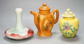 A Chinese enamelled yellow-ground jar and cover, a pottery teapot and cover and a flambe vase,