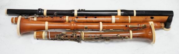 Two 19th century flutes by W. Potter, one in boxwood, the other ebony, and two 19th century