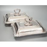 A pair of electroplate entree dishes and covers, 30cm