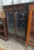 An early 20th century glazed oak two door bookcase, length 99cm, depth 29cm, height 150cm