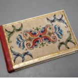 An Austrian beadwork cover souvenir album of watercolours and Berlin woolwork.15 cms wide.