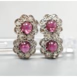 A pair of cabochon garnet and diamond set double cluster earrings (lacking butterflies), 14mm, gross