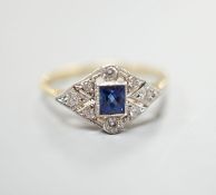 A 1920's 18ct, sapphire and diamond set shaped cluster ring, size N, gross weight 2.5 grams.