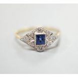 A 1920's 18ct, sapphire and diamond set shaped cluster ring, size N, gross weight 2.5 grams.