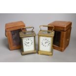 Two leather cased brass carriage timepieces, 14 cms high including case.