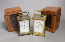 Two leather cased brass carriage timepieces, 14 cms high including case.