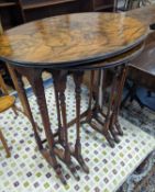 A nest of three oval and circular burr and simulated walnut tea tables, width 55cm, depth 37cm,