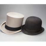 An Army & Navy Stores Ltd. grey top hat and a Christys of London black riders bowling hat, both