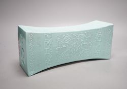 A Chinese turquoise glazed pillow, 33 cms wide.