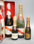 Two bottles of Mumm champagne and two small bottles of champagne