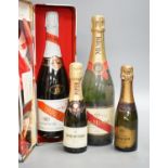 Two bottles of Mumm champagne and two small bottles of champagne